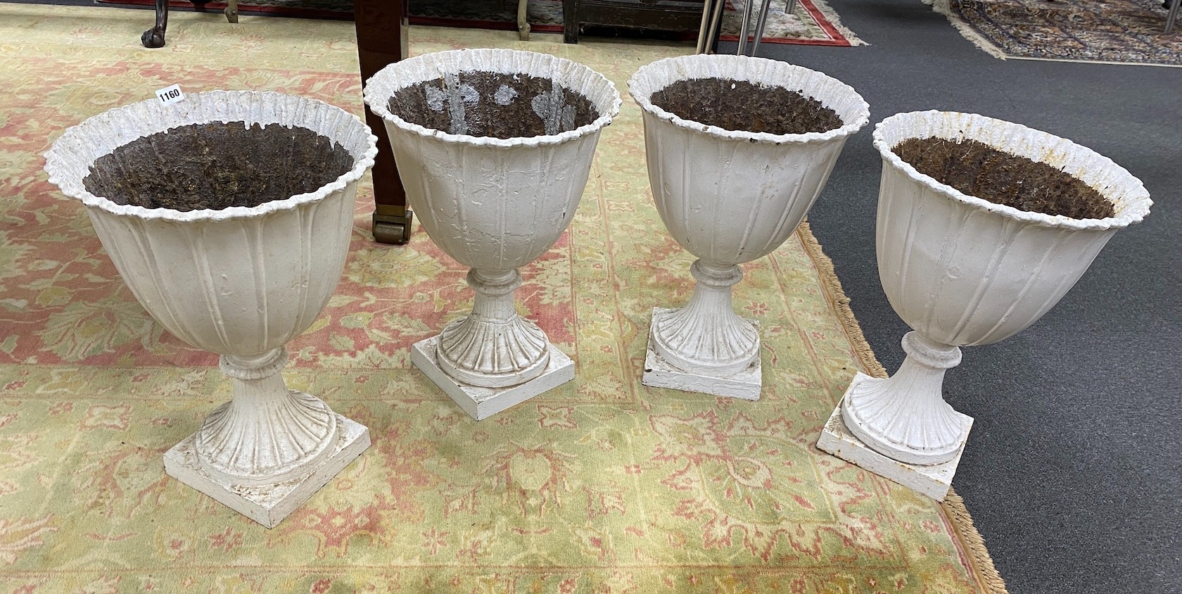 A set of four Victorian painted cast iron garden urns, diameter 38cm, height 53cm